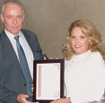 Thierry Logeais receives the SAIMC presenter certificate from Debbie Scott